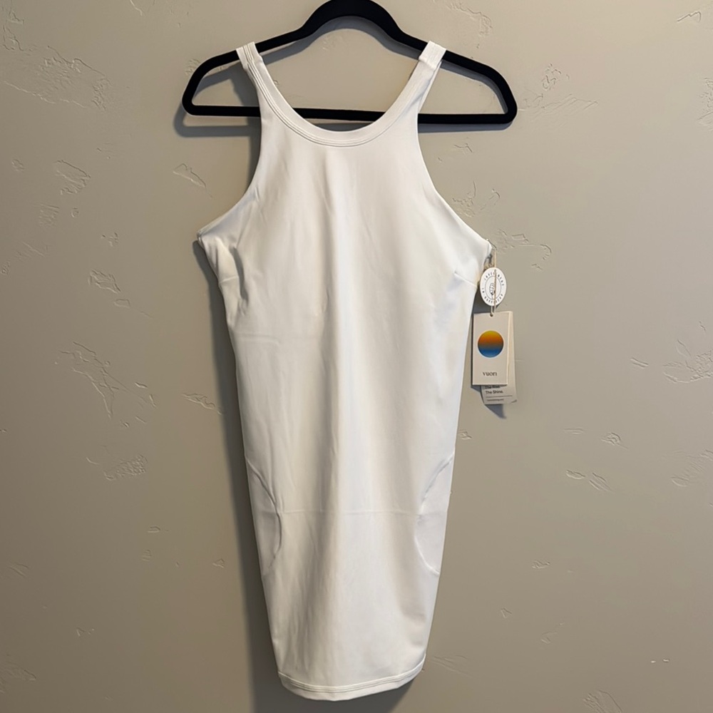 Vuori Volley tennis dress. NWT. White with pockets and attached bra. Size Large